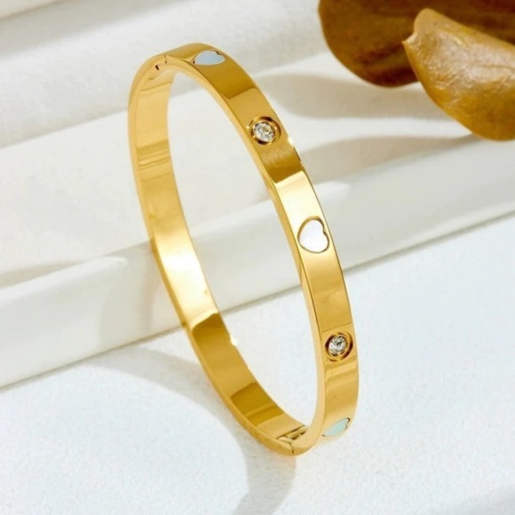 Elegant Gold Bangle with Heart Accents - Picture 1 of 2
